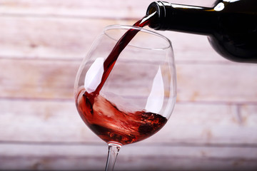 Pouring wine into glass and background - 63907294