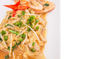 A plate of char kway teow with prawns and gravy