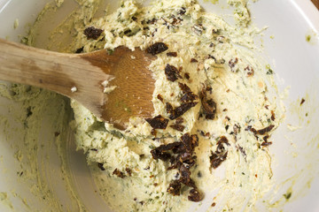 Making Pesto Crostini with Goat's Cheese and Sun Dried Tomatoes: