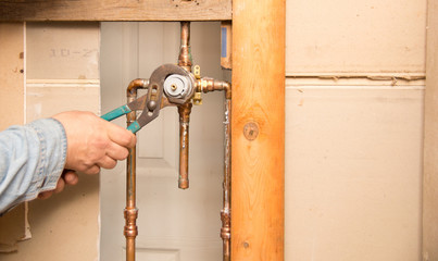 Plumber work in bathroom