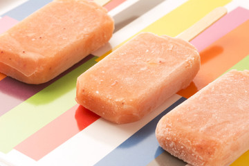 Strawberry, Orange, Pineapple, Mango Fruit Popsicles Shot From A