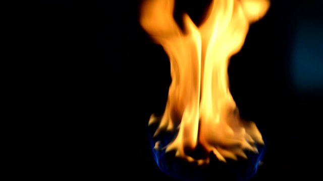 Natural gas in old and rusty portable stove burner.