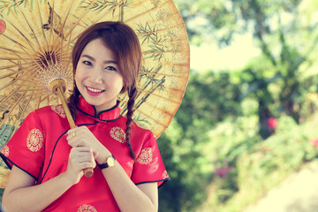 Chinese girl with dress traditional Cheongsam