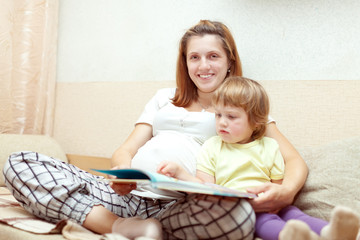 Fototapeta na wymiar Mother and child reading book