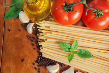 spaghetti ingredients on wood