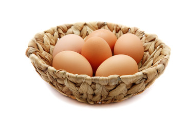 Eggs in a wattled basket  isolated