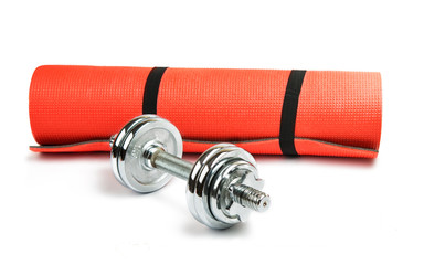 mat for fitness with dumbbells