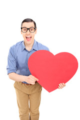 Man holding a big red heart