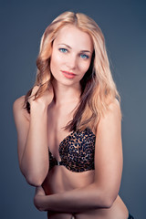 beautiful  blonde female model on blue background