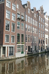 Obraz premium Water canal and typical architecture in Amsterdam, Netherlands