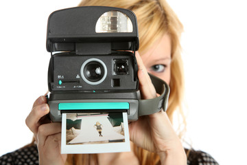 Girl with old point and shoot instant camera - 63919697