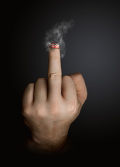 stop smoking concept. cigarette like a middle finger