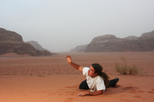 Desperate man in the desert longing for something