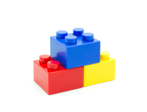Plastic building blocks on white background