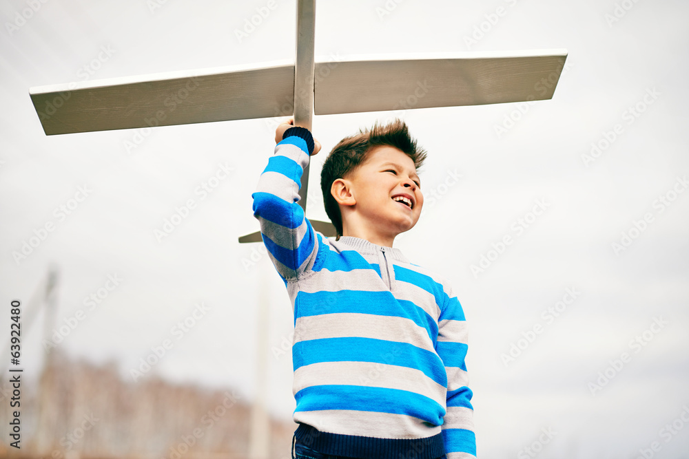 Poster playing with toy airplane