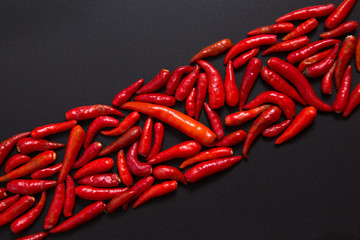 Row of non-stem red bird eye chili peppers
