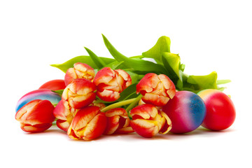 Colorful Easter eggs and red tulips.