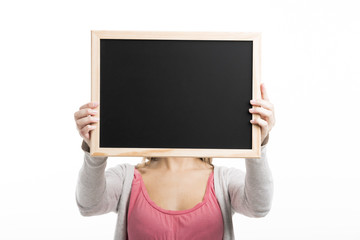 Beautiful blonde woman standing over a white background 