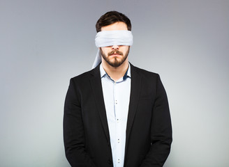 Blindfolded elegant man