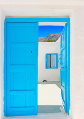 blue coloured wooden door in Amorgos island in Greece