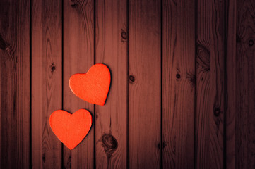 Valentines Day background, two hearts on wooden texture