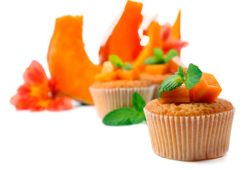 Tasty pumpkin muffins, isolated on white
