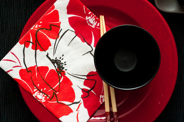 Black bowl, red plate, asiatic sticks
