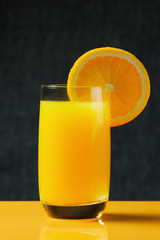 Orange slice and glass of juice