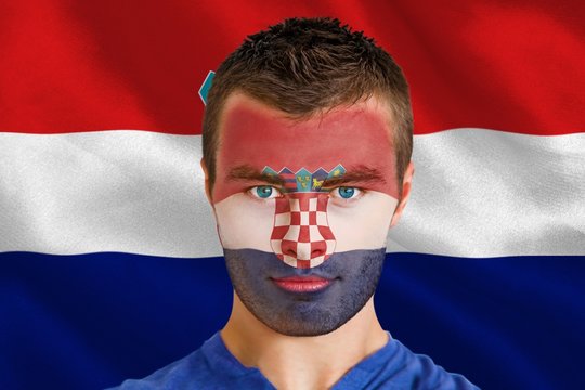 Composite image of serious young croatia fan with facepaint