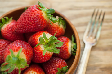 Strawberries in a Bowl with fork on the side