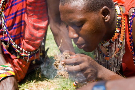 Masai making fire in Masai Mara National Park
