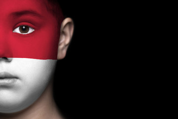 Human face painted with flag of Monaco