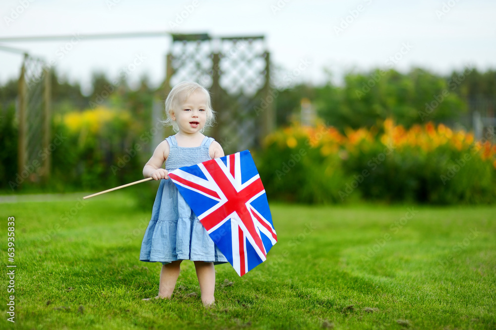 Wall mural adorable little girl with united kingdom flag