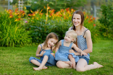 Young mother and her two little daughters