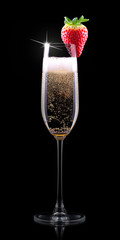 glass of champagne with tasty strawberry