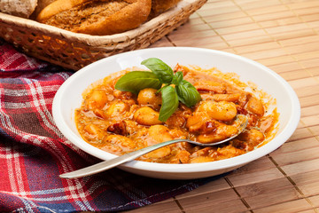 Beans with tomato sauce, bacon and sausage