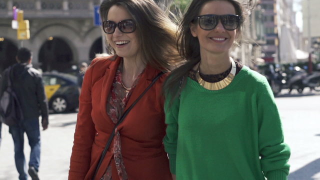 Happy, funny girlfriends in the city, super slow motion