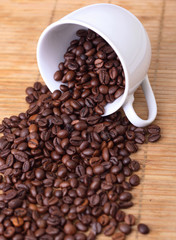 Coffee beans on a cup spilled