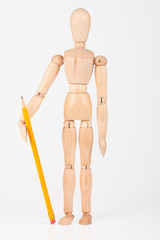 Small wood mannequin standing with colour pencil isolated on whi