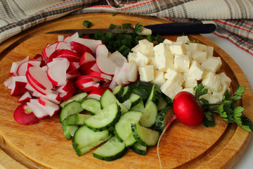 Sliced vegetables on a cutting board.