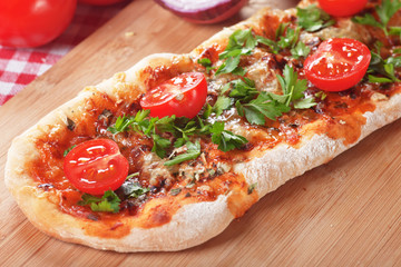 Homemade pizza with parsley and cherry tomato