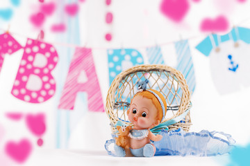 Baby boy shower decor in blue and pink elements