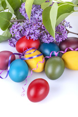 Colorful Easter eggs with lilac flowers