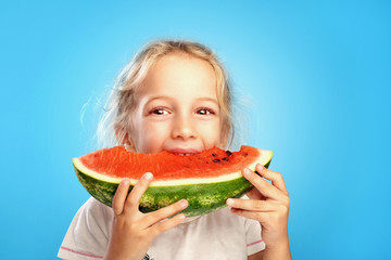 Girl eats watermelon