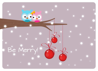 Fototapeta na wymiar christmas card, lovely cute owls couple on branch under snowfall