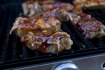 Barbecue pork cooking on a grill