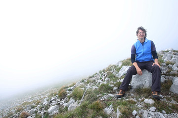 Man sitting on mountain peak