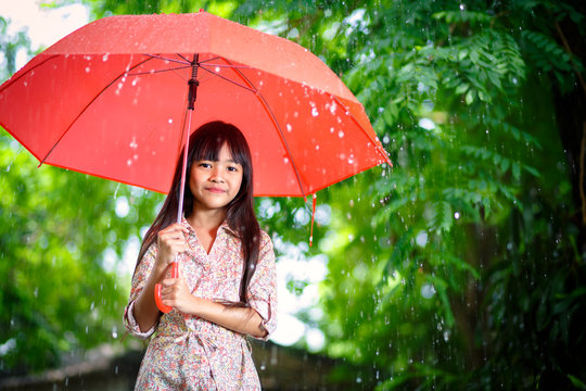 Little asian girl with umbrella