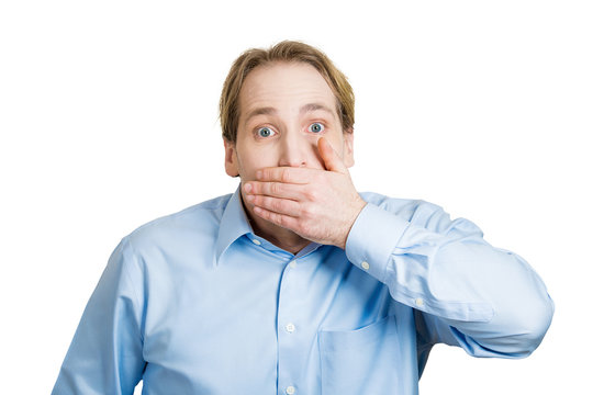 Disbelief surprise. Man covers his mouth with hand, shocked