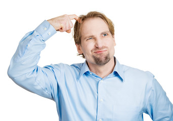 Confused man puzzled, trying to remember right answer